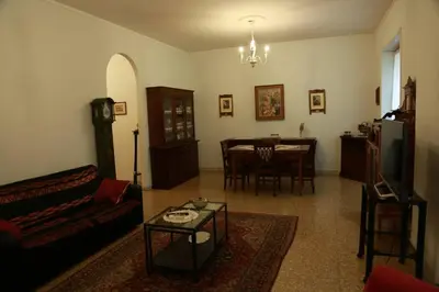 a living room with a couch and a table at San Peter’s Heaven’s Door in Rome
