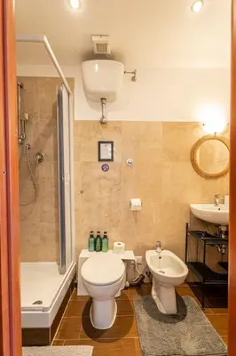 a bathroom with a toilet and a sink at BigFamilyRome-Vatican&Aurelio in Rome