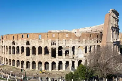 a large amphitheater with a building in the background at Colosseo View Atmosphere by Rental in Rome in Rome