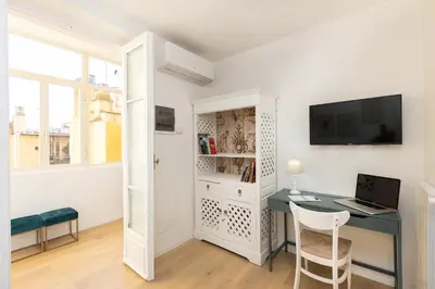 a small room with a desk and a computer at Colosseo View Atmosphere by Rental in Rome in Rome