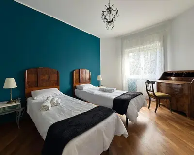 a bedroom with two beds and a piano at Splendido appartamento in Rome