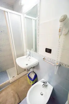 a bathroom with a sink and a mirror at Funny Palace Hostel in Rome