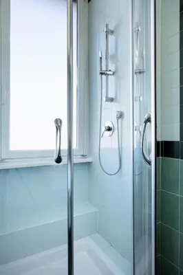 a shower with a glass door in a bathroom at The Attico_Prati in Rome