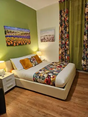 a bedroom with a bed in a room at Blessed Way in Rome