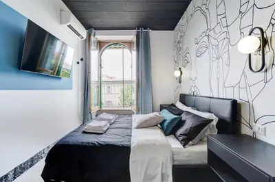 a small bedroom with a bed and a window at BDC - Rome with a view! in Rome