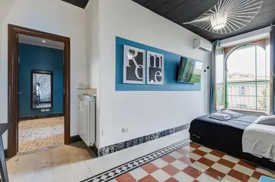 a bedroom with a bed and a window at BDC - Rome with a view! in Rome