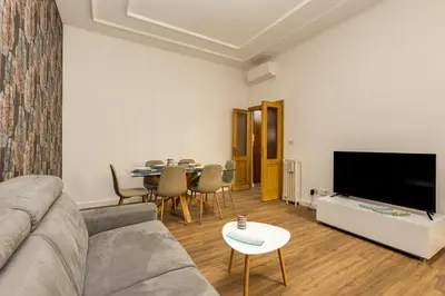 a living room with a couch and a table at Giuliana Vatican Luxury Home in Rome