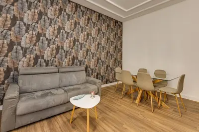 a living room with a couch and chairs and a table at Giuliana Vatican Luxury Home in Rome