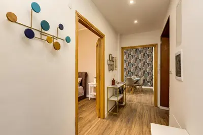 a hallway with a door leading to a living room at Giuliana Vatican Luxury Home in Rome