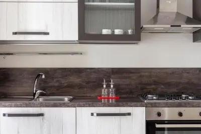 a kitchen with a sink and a counter top at Colosseo Road by Hili in Rome