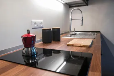 a kitchen with a sink and a counter top at FUORI dal TEMPO Roma Trastevere in Rome