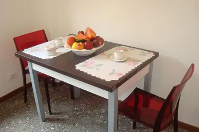 a table with a bowl of fruit on it at Apartment Bruno's in Rome