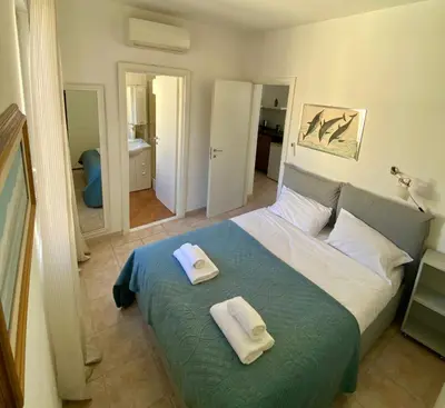 a bedroom with a bed with two towels on it at Appartamento S. Pietro in Rome