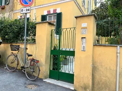 a bike parked next to a building with a green door at Appartamento S. Pietro in Rome