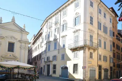 a large white building on a city street at Farnese Apartment Navona Historic Center in Rome