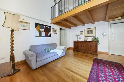 a living room with a couch and a table at iFlat Retro Chic Apartment in Prati in Rome
