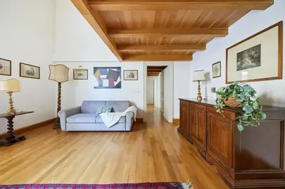 a living room with a couch and a wooden ceiling at iFlat Retro Chic Apartment in Prati in Rome