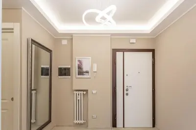 a room with a ceiling with a mirror and a door at 2-Bedroom Retreat near Metro & Parks in Rome