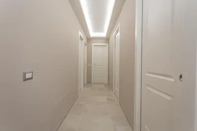 a hallway with a door and a ceiling at 2-Bedroom Retreat near Metro & Parks in Rome