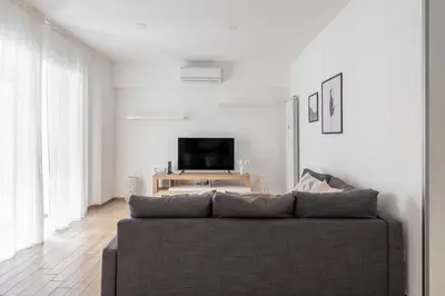 a living room with a couch and a tv at LoveRhome Apartment 1 in Rome