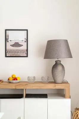 a table with a lamp and a bowl of fruit on it at LoveRhome Apartment 1 in Rome