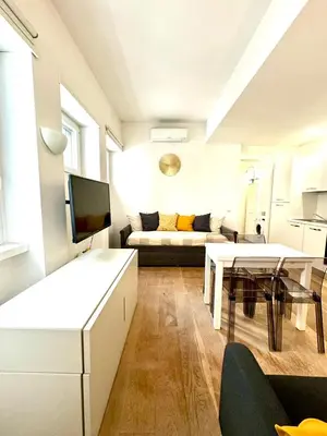 a living room with a couch and a table at Matilda House EUR 4 posti letto in Rome