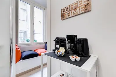 a room with a coffee maker on a table at Classy 2-bdr in Termini district in Rome