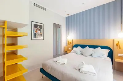 a bedroom with a bed with two towels on it at Mom's home - A few stops from the city centre in Rome