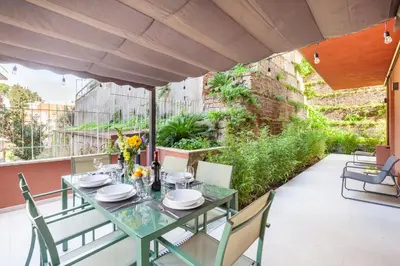 a table and chairs on the balcony of a house at Mom's home - A few stops from the city centre in Rome