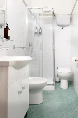 a bathroom with a sink and a toilet and a shower at Hotel Domus Rome in Rome