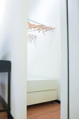 a room with a fireplace and a shelf of wooden sticks at Suite 52 Trastevere in Rome