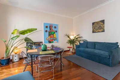 a living room with a table and a couch at PgrHome Barberini in Rome