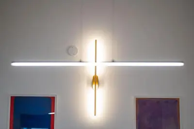 a light hanging on a wall with two windows at PgrHome Barberini in Rome