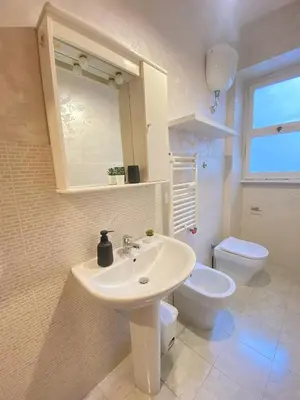 a bathroom with a sink and a toilet at Golden Essence Apartment - terrace & metro in Rome