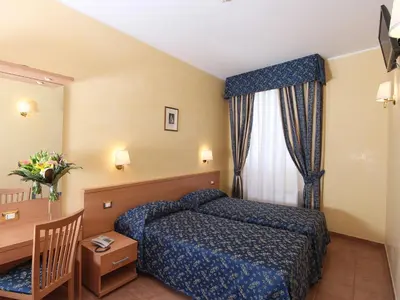 a hotel room with a bed and a window at Casa Di Santa Francesca Romana a Ponte Rotto in Rome