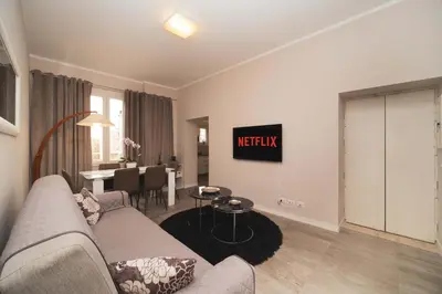 a living room with a couch and a table at Venus Penthouse - Favoloso attico in pieno centro a Roma in Rome