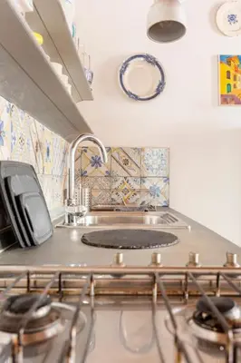 a kitchen with a sink and a counter top at Delizioso appartamento a Trastevere in Rome