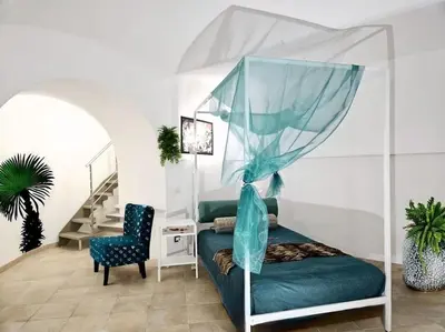 a swimming pool with chairs and umbrellas at La finestra sul Nasone in Rome