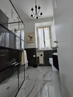a bedroom with a zebra print bed with a picture on the wall at La finestra sul Nasone in Rome