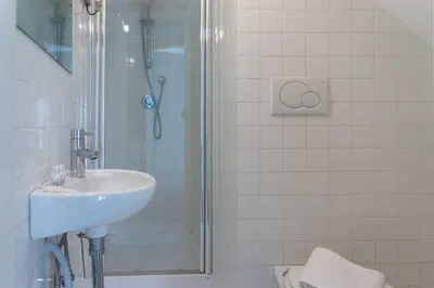 a bathroom with a sink and a shower at Lusso e panorama senza paragoni, Loft Trastevere in Rome