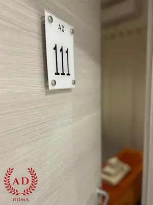 a lightswitch on the wall of a hospital room at 111 ColaDiRienzo Rooms - by AD Roma in Rome