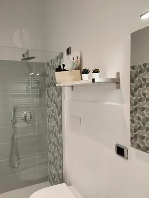a bathroom with a toilet and a glass shower at 111 ColaDiRienzo Rooms - by AD Roma in Rome