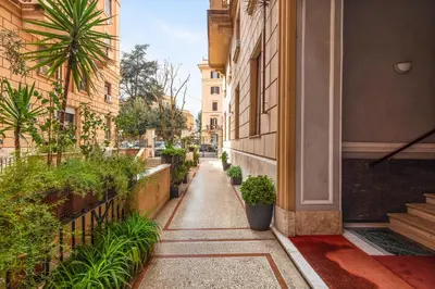 a narrow alley with plants on the side of a building at Donatello Boutique Apartment in Rome