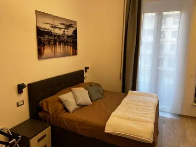 a bed with two pillows on it in a bedroom at Love4Rome Guest House in Rome