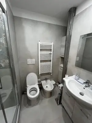 a bathroom with a toilet and a sink at Love4Rome Guest House in Rome