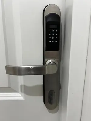 a door handle with a cell phone in it at Love4Rome Guest House in Rome