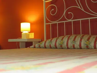 a bedroom with a bed with a lamp on it at Vista sul Tevere in Rome