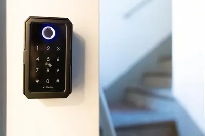 a remote control on a door with a staircase at Trastevere 68 Stylish Apartment in Rome