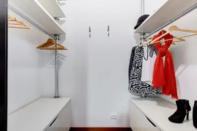 a walk in closet with black and white bags and shoes at BDC - Fancy 2-Bdr Apt @Vatican in Rome