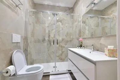 a bathroom with a shower and a toilet and a sink at Trinita Rooms in Rome